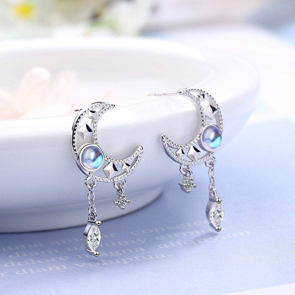 Boucles d'oreilles pompon pierre de lune