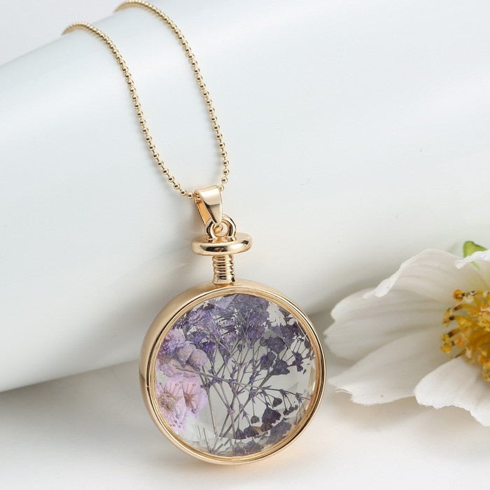 Collier pendentif fleur violette