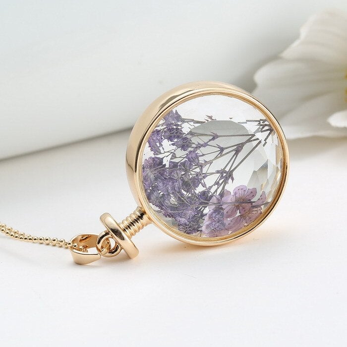 Collier pendentif fleur violette