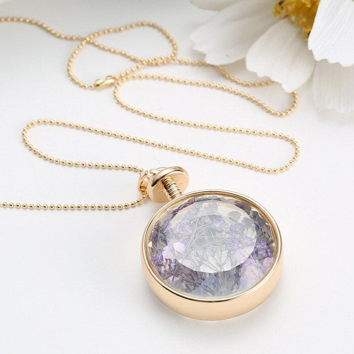 Collier pendentif fleur violette