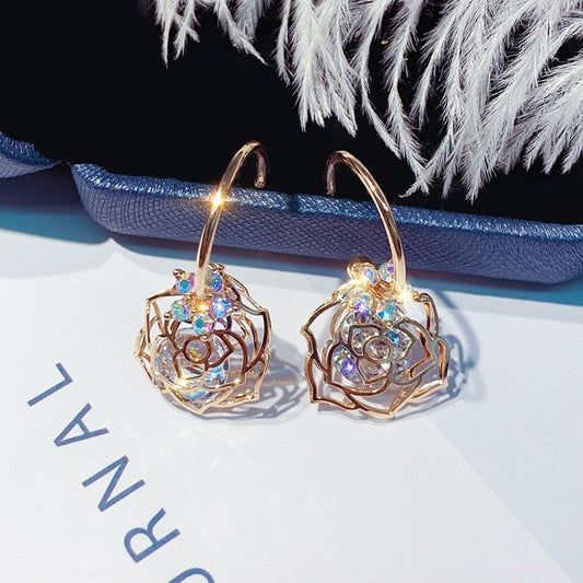 Boucles d'oreilles roses en cristal blanc