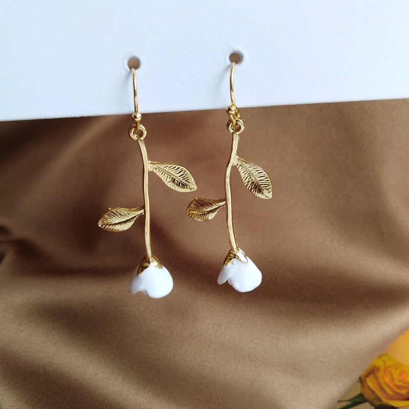 Boucles d'oreilles roses blanches